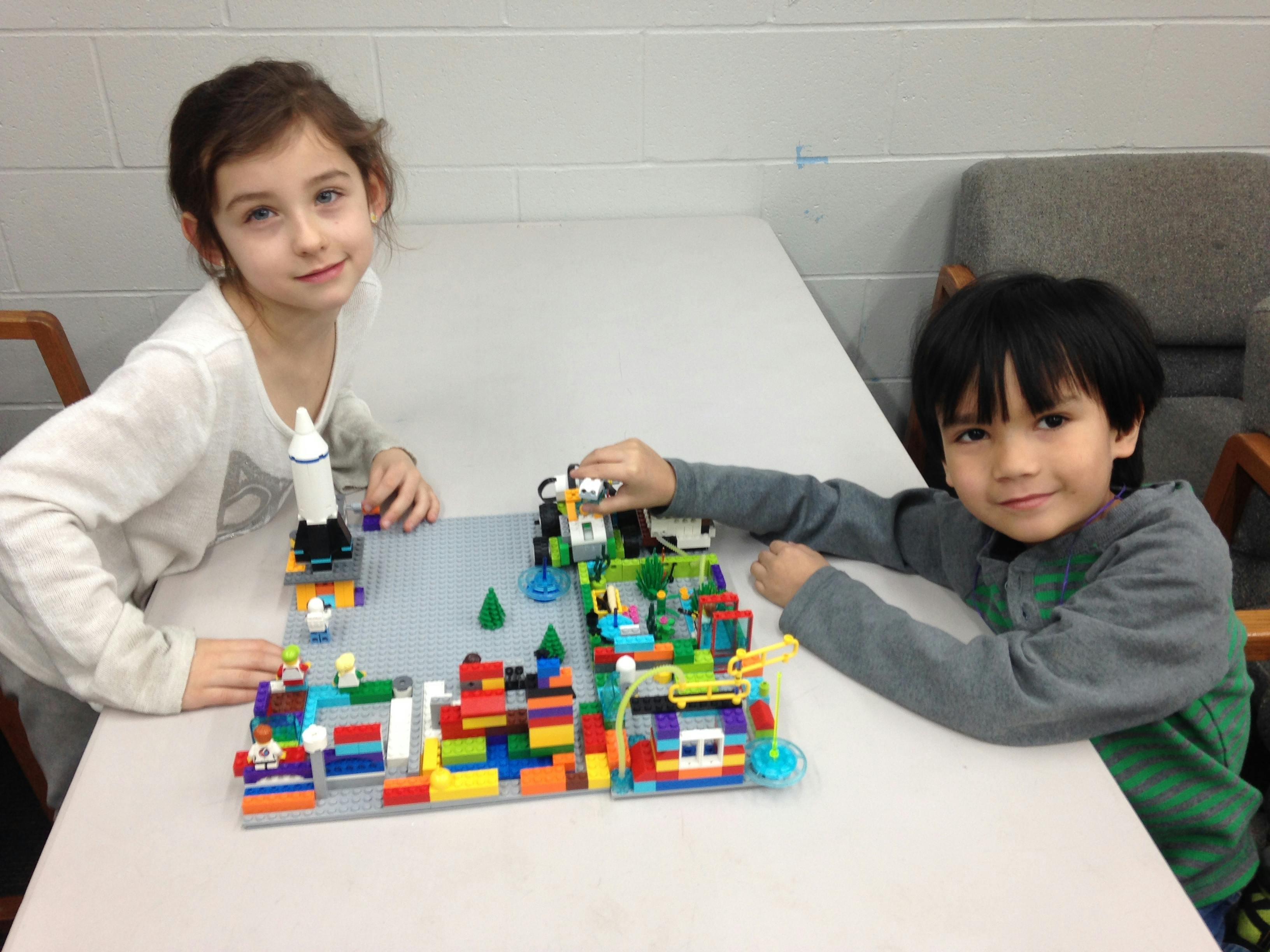 Two children play with a lego set at Boys and Girls Clubs St Charles